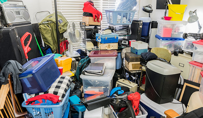 Messy room filled with clutter and boxes