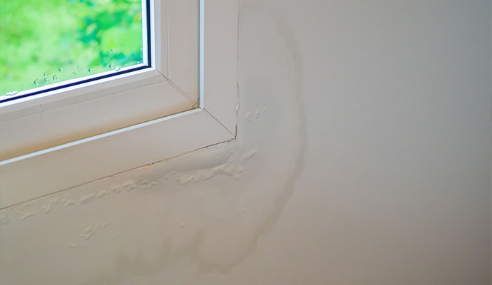 Window corner with visible water stains