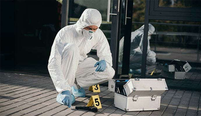 Forensic technician investigating a crime scene