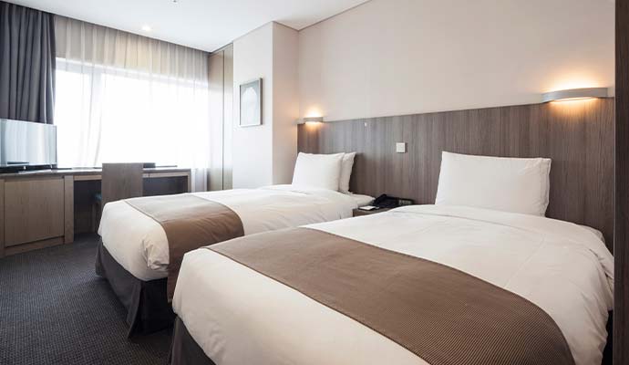 Modern hotel room double bed interior