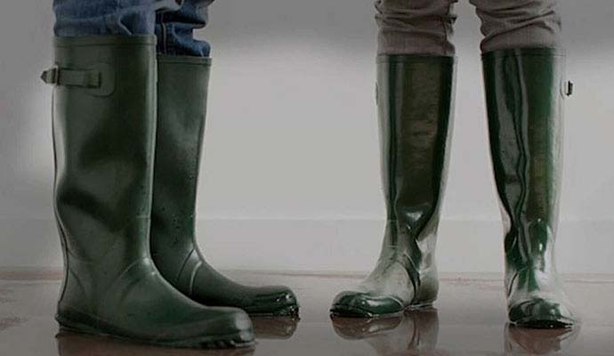 Protective rubber boots worn during sewage backup cleanup