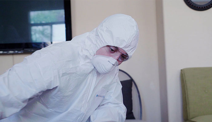 Professional worker in HAZMAT suite