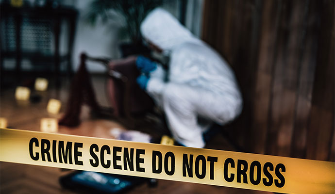 Professional inspecting in crime scene areas